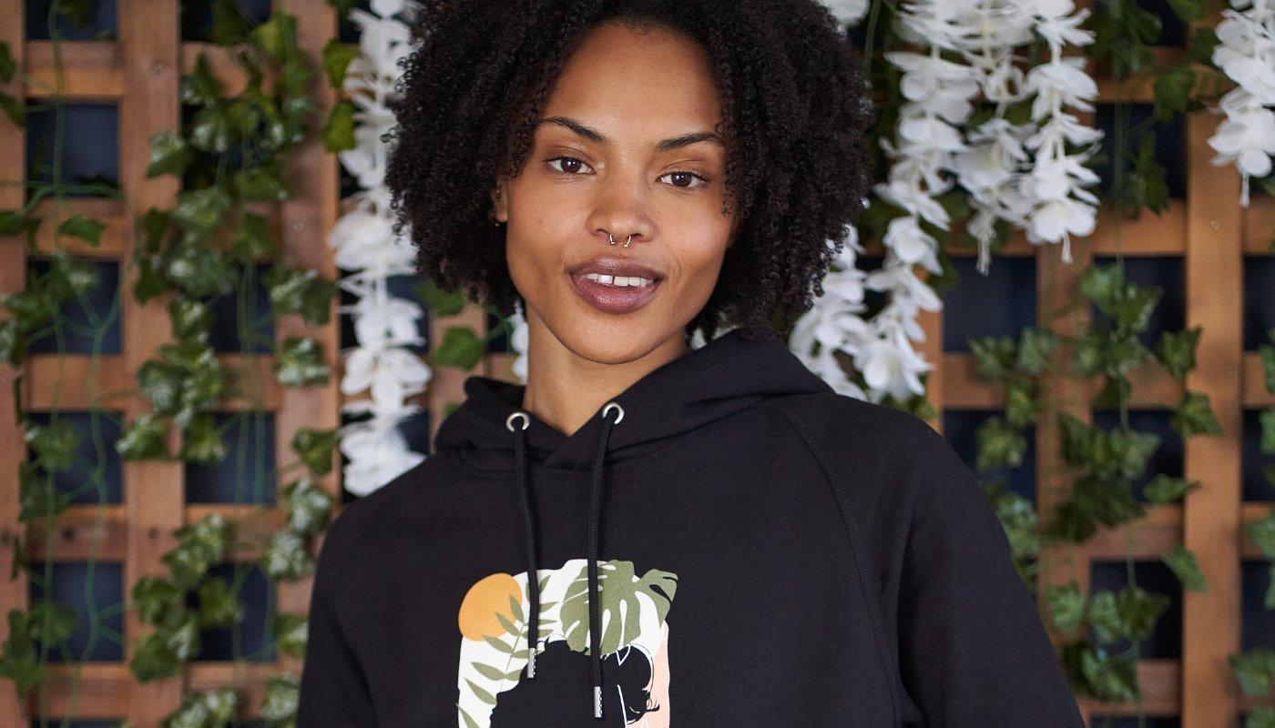 girl modeling a sustainably designed hoodie